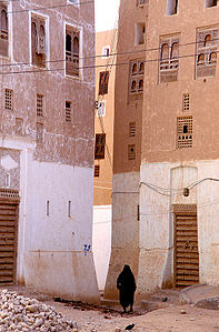 Two buildings on a street inside the town