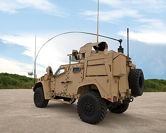 Rear three-quarter view of an Oshkosh L-ATV in M1278 Heavy Guns Carrier JLTV configuration