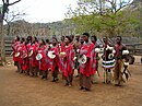Swazi people dancing in a cultural village show.