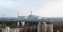 View of Chernobyl taken from Pripyat zoomed.JPG
