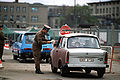 East German officer monitors traffic returning to East Berlin, November 1989.