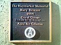 The plaque on Mary Brogger's Haymarket Riot|Haymarket memorial in Chicago. Note the seal of the City of Chicago has been painted over with Anarchist symbols.