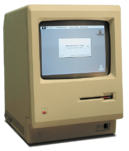 A Macintosh 128K running Finder 5.2 American transparent background.