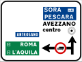 Esempio di segnale di preavviso di intersezione urbana con limitazione di transito agli autocarri