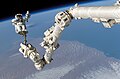 Astronaut Steve Robinson on Canadarm2 during STS-114 mission