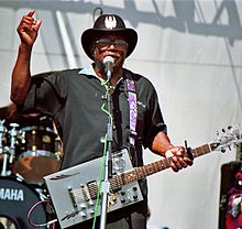 Bo Diddley performing on-stage