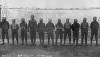 Football team of British soldiers with gas masks, Western front, 1916