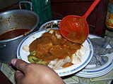 Sliced siomay poured with peanut sauce