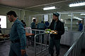 ANP cadets carrying food trays inside the dining area of a training center