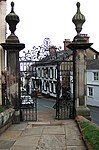 Gates, overthrow, side screen gatepiers and steps, with handrails, south-east corner of churchyard