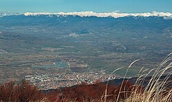 Sandanski–Petrich Valley seen from Belasitsa mountain range with the snow-capped peaks of the Pirin mountains