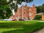 Trafford Hall with attached service wing and carriage house