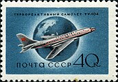 timbre bleu, représentant un Tu-104 posé devant un globe terrestre.