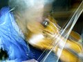 Violinist shot at a slow shutter speed in the style of the Italian Futurist painters/photographers