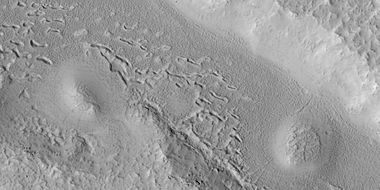 Hollows in surface, formed as ice is removed from ground, as seen by HiRISE under HiWish program