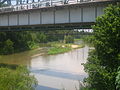 Scenic view of Colorado River meandering under a bridge overpass under State Highway 60 in Wharton