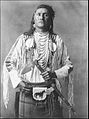A nineteenth century photograph of a Plains Indian showing a belted bag known as a medicine pouch
