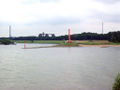 Estuary of the river Ruhr (left) into the Rhein at Duisburg-Ruhrort, in the middle the sculpture Rheinorange.