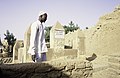 A man at the grave of Bitòn Coulibaly, Ségoukoro