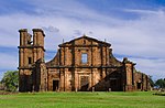 Ruins of a stone church facade and tower