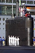 Sailors aboard Miami man the rails as they prepare to moor at Port Everglades, Florida, Fleet Week. (26 April 2004)