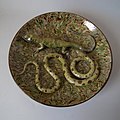 Wall plate, c. 1900, coloured and mottled glazes in Palissy style