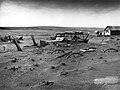 Image 14 Dust Bowl Photo credit: Sloan, USDA Buried machinery in a barn lot, Dallas, South Dakota, United States, due to Dust Bowl conditions, May 1936. Dust storms from 1930–1939 caused major ecological and agricultural damage to American and Canadian prairie lands. This ecological disaster was a result of drought conditions coupled with decades of extensive farming using techniques that promoted erosion. More featured pictures