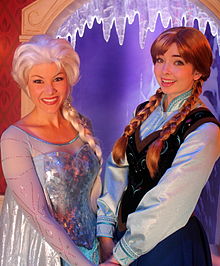 Two cosplayers of Elsa and Anna holding hands and doing a Meet and Greet at Disneyland