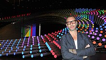 Florian Standing next to the Eurovision Song Contest 2015 stage which he designed