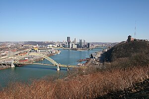 Daytime view from the West End Overlook, with the West End Bridge in the foreground and the downtown skyline in the background