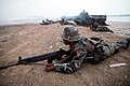 An Ecuadorian marine and his squad in beach assault training after exiting an AAVP-7A1