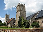 Church of the Nativity of St Mary with brick retaining wall to the north