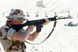 A United States Marine with a British L1A1 SLR, during a training exercise as part of the Gulf War's Operation Desert Shield.