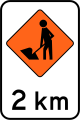 (TW-1B.1.2) Road workers ahead in 2 kilometres