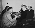 Defendants eat lunch during a pause in the trial