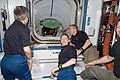 Expedition 20 crew members are pictured Discovery's crew ingress through the Pressurized Mating Adapter 2.