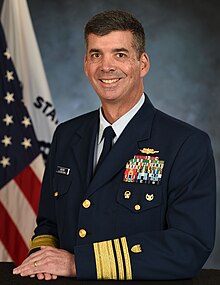 Rear Admiral Nathan A. Moore smiling at the camera