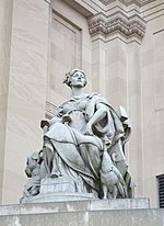 Stone statue of a seated woman