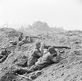 British commandos man two Vickers machine guns in the shattered outskirts of Wesel, 23 March 1945.