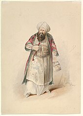 Standing man in Ottoman outfit and long dark beard