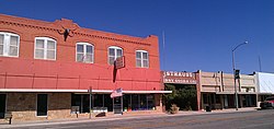 Strauss Dry Goods Co. storefront, which has been converted into a public park, and adjoining building