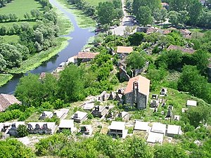 The village church and graveyard under the castle