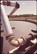 ANEROBIC DIGESTER. RAW SEWAGE SLUDGE, MIXED WITH BACTERIA, IS HEATED AND BROKEN DOWN INTO A NON-TOXIC COMPOST... - NARA - 543796.jpg