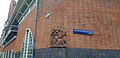 Post office: outside view detail of the corner of the Zaanstraat - Spaarndammerplantsoen with a brick sculpture