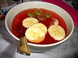Kisiel, a dessert served with bananas and grapes. When more water added, kisiel can be served as a hot beverage.
