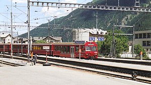 Red train at island platform