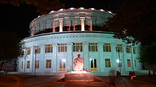 The Opera House building at night.