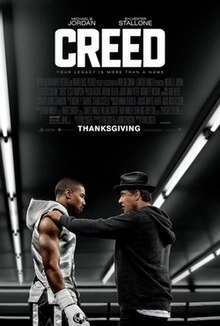 At a boxing ring in a gym, Rocky Balboa (Sylvester Stallone) looks at Donnie Creed (Michael B. Jordan) with Rocky's left hand resting on Creed's right shoulder. The films tagline reads "Your Legacy is more than a name" with credits and the film's title on the top.