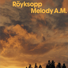 A photograph of an orange sky with clouds. Some trees are on the bottom of the picture and the album name and the name of the duo are displayed above.