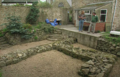 Phil Harding and Jim Ridge above the remnants of the fort in the property's back garden, which was initially excavated in the 1970s. Looking east